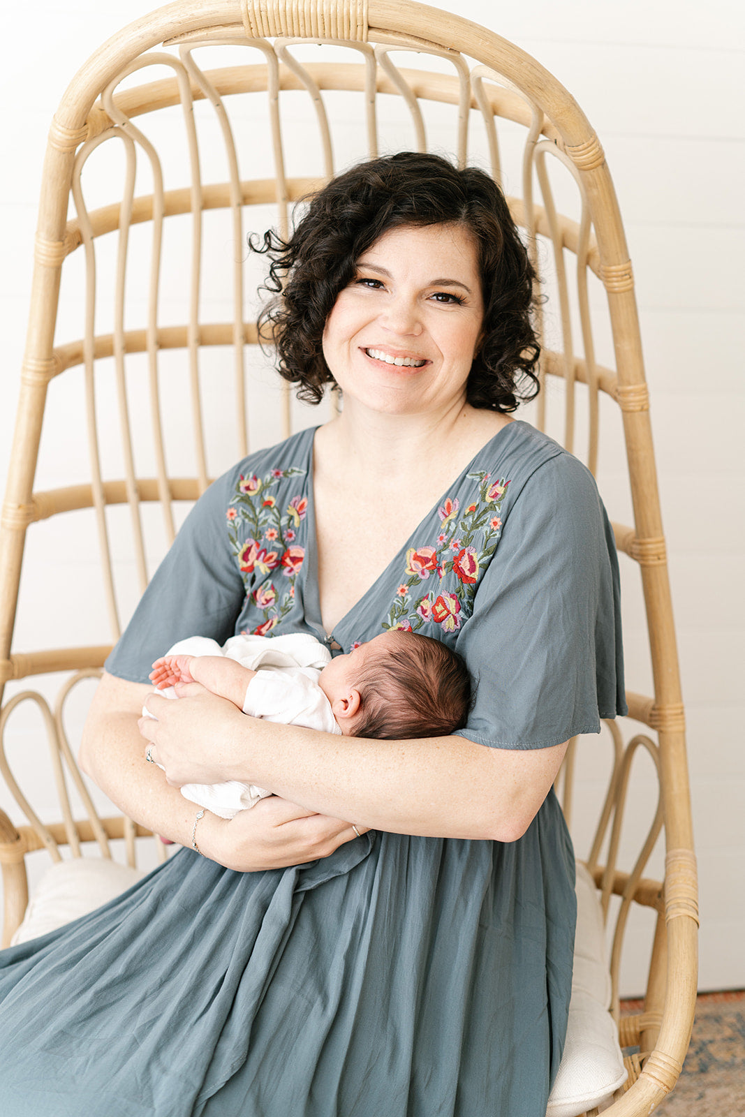 Portrait of founder Brittany Howard in dress with baby